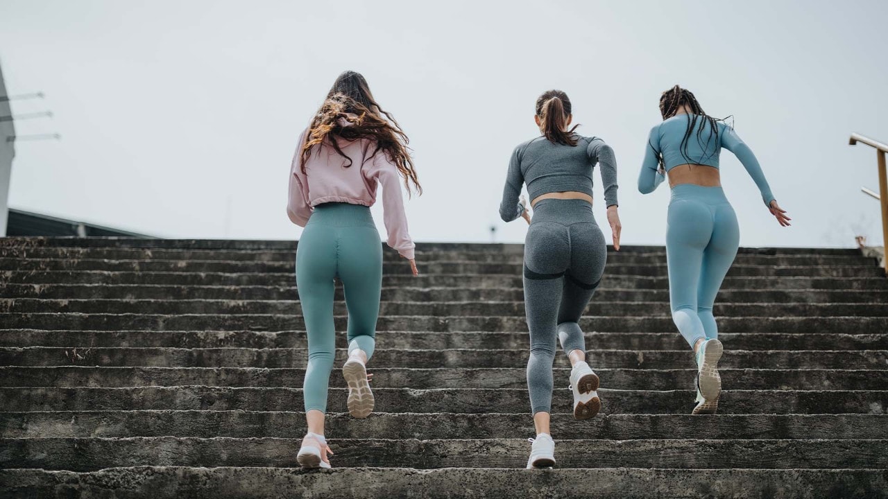 Woman and man in tone-on-tone activewear attire