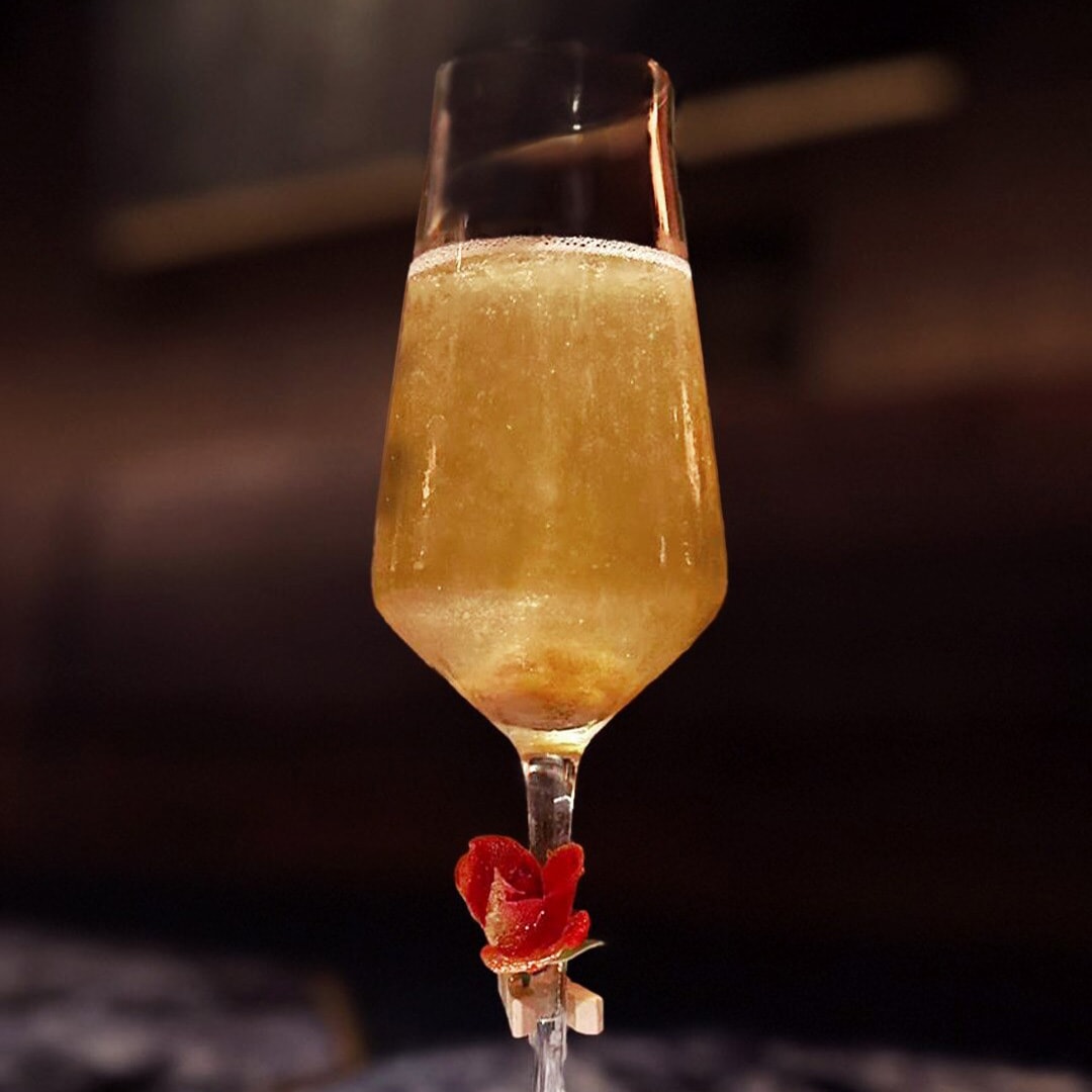 Specially crafted cocktail in a golden yellow hue to celebrate 2024 Mother's Day